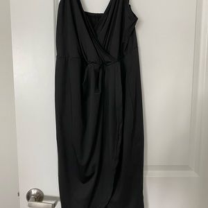 Black spaghetti strap wrap dress with slit that sits beautifully. Never worn!